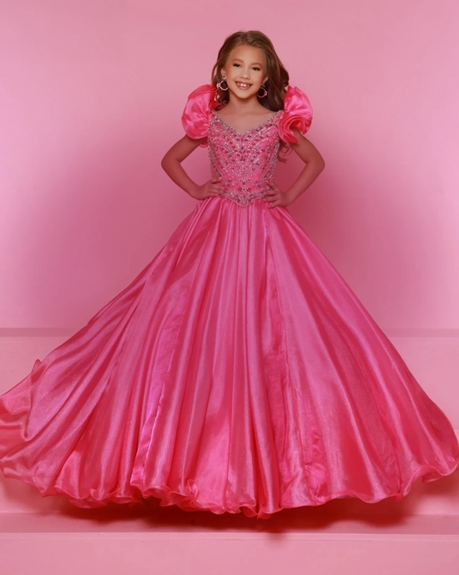 Model wearing a pink dress. Mobile image